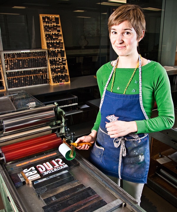 Claire Taylor using a letterpress printing machine.