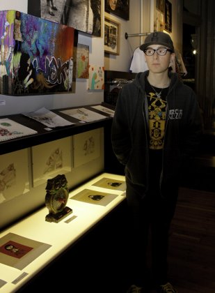 Casey Blandford poses next to his pieces.