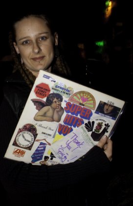 A lucky raffle winner shows off her new soul record, courtesy of Randy's Records.