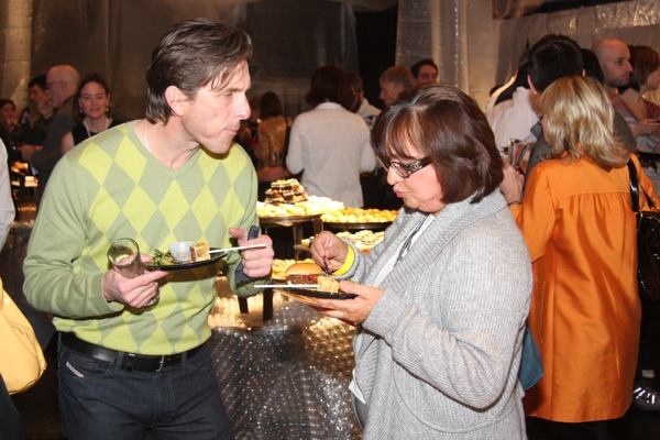 Chris Young from Jazz Dancer Studio and Soledad Penka, mother of dancer Corrine Penka, both sample Communal’s apple bread pudding pops. Photo by John Carlisle :: SLUG Magazine