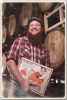 Travis Bone with his label design for Uinta�s Cockeyed Cooper Bourbon Barrel Barley Wine Ale for the Crooked Line. Photo: Barrett Doran