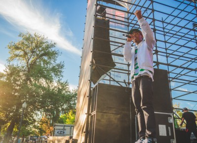 Bishop Nehru throws a fist in the air as he rushes across the stage to the crowd singing right along with him.