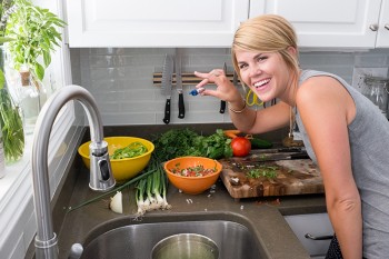 Adrienne Tuerpe smiling and posing with homemade watermelon salsa