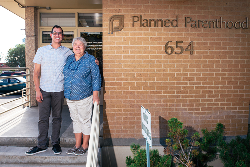 (L–R) Artist Jorge Rojas and Planned Parenthood Association of Utah Director Karrie Galloway stand united in preparation for Planned Parenthood’s fundraising gala, The Art of Safe Sex.