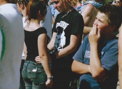 A couple standing close to each other at Vans Warped Tour 2005.