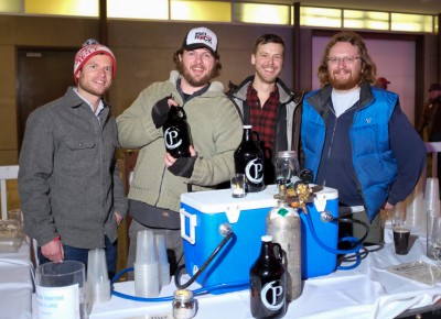 (L-R) Jake Miller, Rio Connelly, Casey Carrigan and Alex Littlefield pour from kegs of Proper Brewing Company’s KRCaLe, a seasonal ale created in collaboration with KRCL’s staff. While DJ Bad Brad might have preferred a tart Saison, KRCaLe is a dark, hoppy beer suitable for winter drinking. Photo: John Barkiple