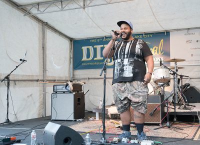 Emcee DJ Dynamic introduced the KRCL Stage bands. Photo: JoSavagePhotography.com