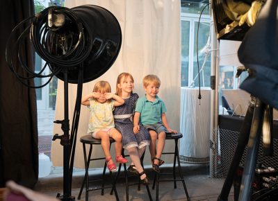 The photographer and mother try to coach the little girl on the left to smile and pose nicely for the photograph. She was not feeling it and made for an even more interesting snap! Photo: JoSavagePhotography.com