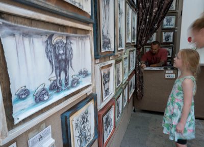 This young girl was so intrigued by Tai’s drawings that her mom had to basically drag her out of his booth when it was time for them to leave. Photo: JoSavagePhotography.com