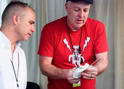 Ryan Carty (R), wipes down a handmade chopstick as Alan Peck watches. Peck uses these chopsticks at dinner parties, where guests learn to make them. Photo: @snowlenda