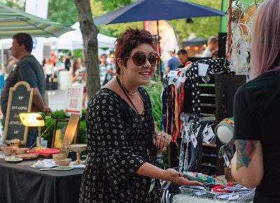 Mackenzie Jones connects with a customer at her Dear River May booth. Photo: @snowlenda