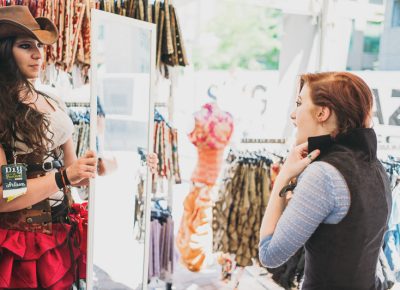 People were eager to try on corsets at the Damsel Dress booth. Photo: @clancycoop
