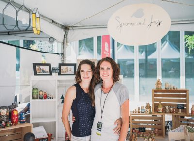 (L–R) Stephanie Engle and Jessica Anderson pose in their booth, which sold beautiful nesting dolls, under the name Sparrow & Jay. Photo: @clancycoop