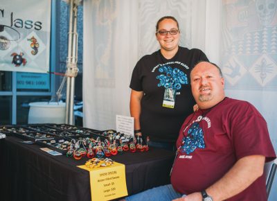 (L–R) Fiona and Mike Hurst show off their one-of-a-kind blown glass art pieces. Photo: @clancycoop