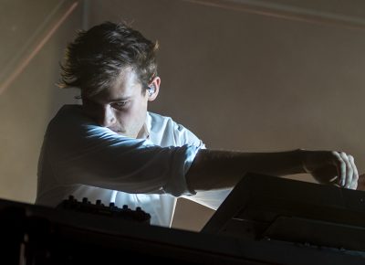 Flume studies his sound board, adjusting each element for a dynamic musical experience. Photo: Colton Marsala