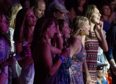 Fans scream in reaction to the giant inflatable horse galloping onstage during Lake Street Dive’s performance of "Side Pony" at Red Butte Garden on Aug. 14, 2016. Photo: John Barkiple
