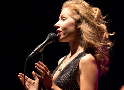 A cool, canyon breeze lifted Price’s hair as the moon rose behind the Red Butte Garden stage during a lively performance by Lake Street Dive on Aug. 14, 2016. Photo: John Barkiple