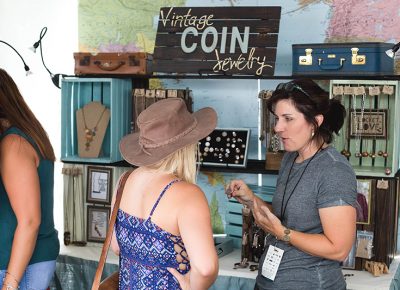 Kelly Annie of Kelly Annie Jewelry discussing her products with a DIY Fest-goer. Photo: @LMSorenson