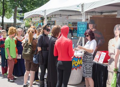 Cosplayers line up for info, tickets and a chance to win prizes at the Salt Lake Comic Con tent. Photo: @LMSorenson
