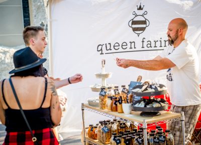 Samples of Queen Farina honey from Wellsville, Utah are handed out to eager festival-goers. Photo: @nellis_j