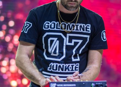 Josh Carter, the goldmine junkie, performs for Salt Lake City fans, mixing music and beats for Big Grams' special blend. Photo: Colton Marsala