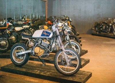 A lineup of diverse custom motorcycles in the invited builder room. Photo: @clancycoop
