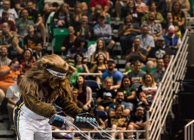 The Jazz Bear absolutely blasts a single fan with silly string during the Salt Lake Comic Con panels at the Vivint Smart Home Arena. Photo: @Lmsorenson