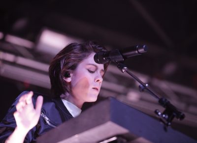 Tegan of Tegan and Sara playing keyboards onstage in Salt Lake City. Photo: @Lmsorenson