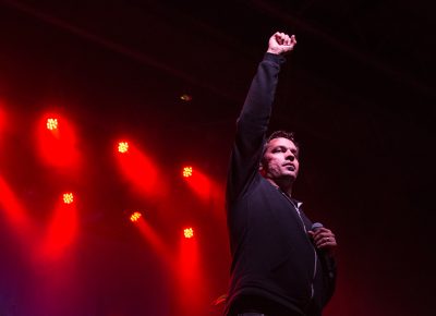 Slug raises his fist above the crowd, starting off another song with a salute. Photo: ColtonMarsalaPhotography.com