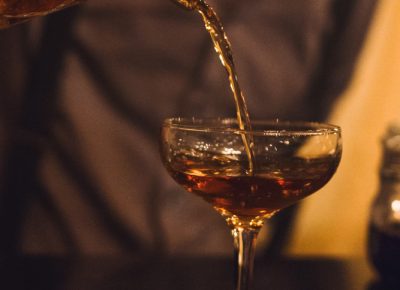 That burnt red work of art being poured over a cherry in a martini glass is what has lead me on a vigorous search for black walnut bitters over the last year. Photo: Talyn Sherer
