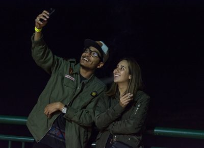 Two fans share a smoke and a selfie in between sets. Photo: ColtonMarsalaPhotography.com