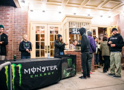 A patron receives a free energy drink, courtesy of Roughside's presenting sponsor, Monster Energy. Photo: Niels Jensen