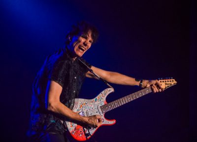 Steve Vai bows to the crowd and his guitar. Photo: Talyn Sherer