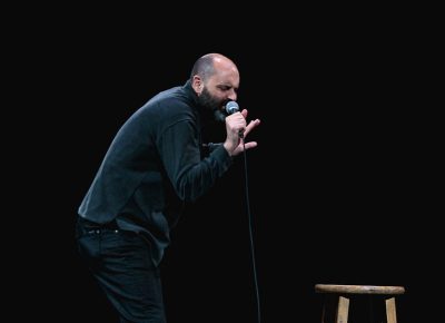 Ted Alexandro, mimicking the playing of a violin. Photo: Lmsorenson.net
