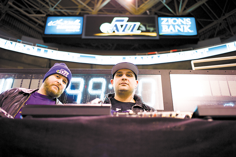 (L–R) Mike Brown watches DJ Juggy work his magic as the Utah Jazz’s in-house DJ.