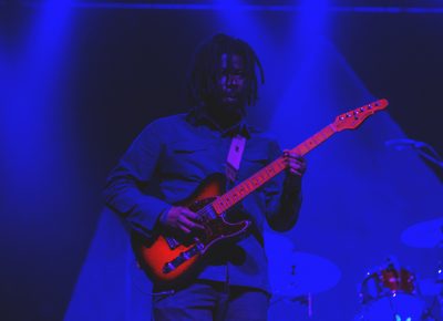 Lewis Del Mar's touring guitarist gets lost in the pale blue lights on stage. Photo: Talyn Sherer
