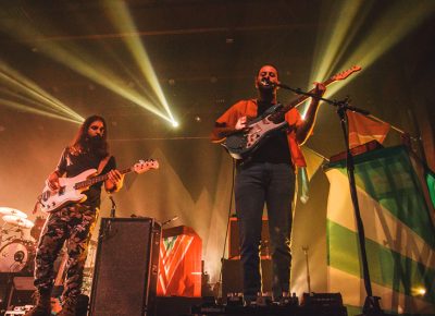 (L-R) Payam Doostzadeh and Eric Cannata of Young the Giant perform under golden lights at the The Complex SLC. Photo: Talyn Sherer.