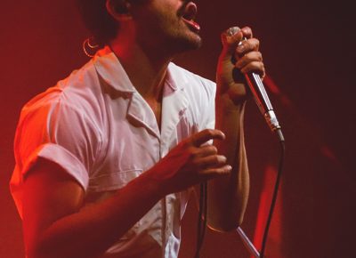 Sporting the white jumpsuit and thin-lines mustache, Sameer Gadhia of Young the Giant is both a fashion icon and musical legend. Photo: Talyn Sherer.