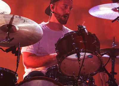 Young the Giant drummer, François Comtois, cranks out the edgy tones from center stage. Photo: Talyn Sherer.