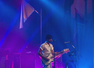 Under the purple and blue lights, Young the Giant calms our nerves with a down tempo song. Photo: Talyn Sherer.