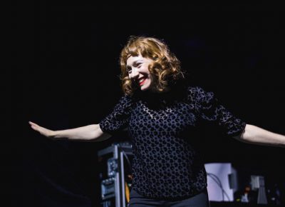 Regina Spektor takes a small curtsy as fans scream in excitement for her to perform. Photo: Lmsorenson.net