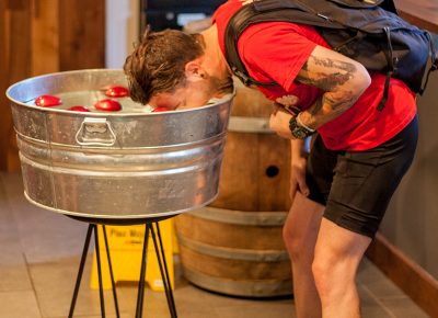 Bobbing for apples at Mountain West Hard Cider. Photo: @ca_visual