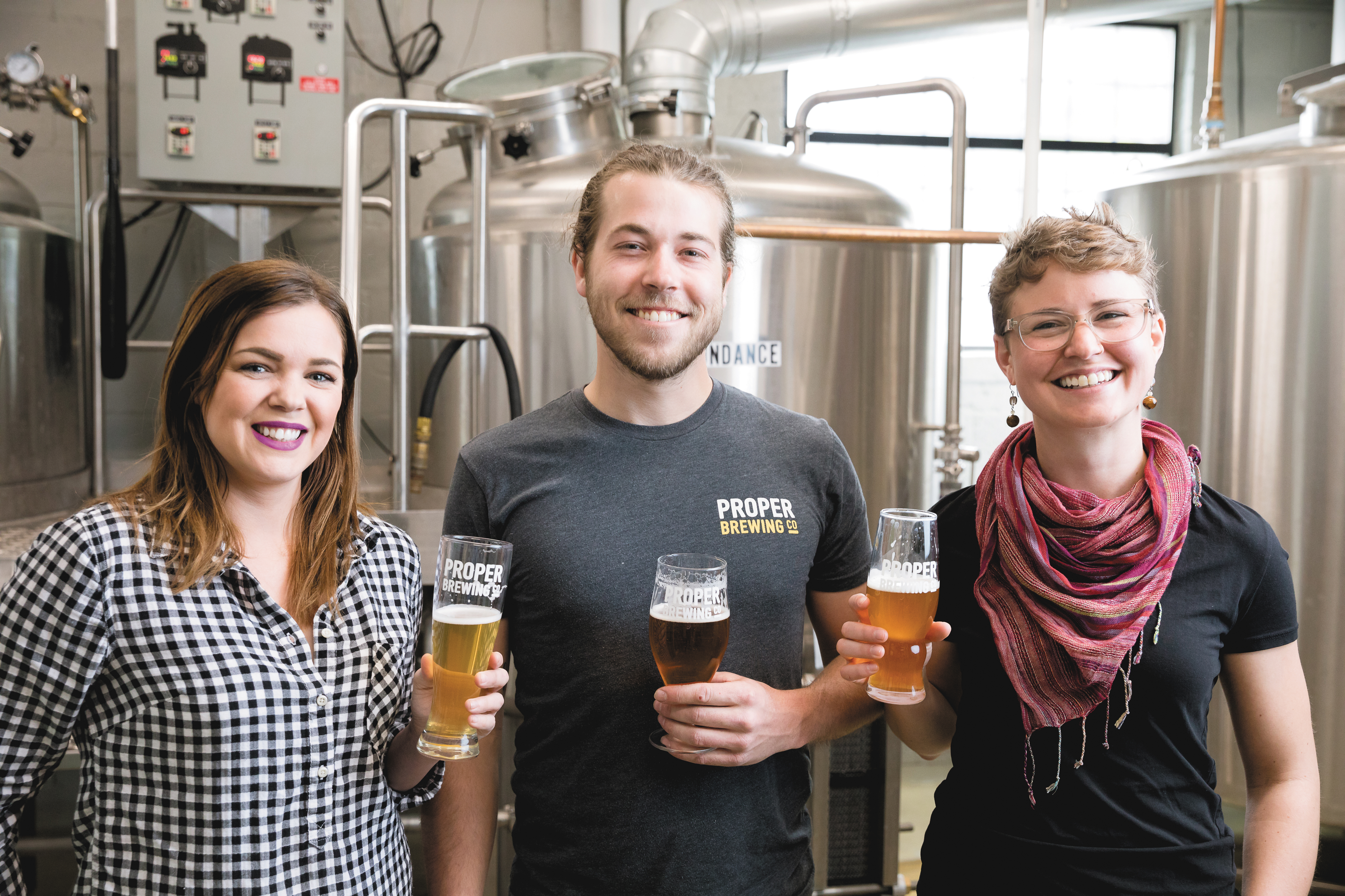 (L–R) Proper Brewing Co. Sales Rep Rebecca Link, Brewer and Head of Packaging Jack Kern and Marketing Coordinator Eleanor Lewis also hold the title of Certified Cicerone, which bespeaks their beer knowledge and expertise. Photo: LmSorenson.net.