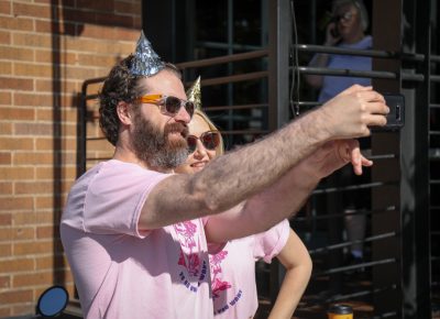(L–R) Caleb Mathis and Mandy Williams start the parade with a selfie. Photo: John Barkiple
