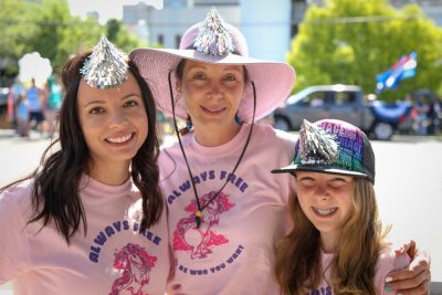 (L–R) Shelbey Lang, Meg Bohun and Teley sport silver unicorn horns to complement their "always free" unicorn shirts. Lang is Craft Lake City’s Artisan Coordinator. Photo: John Barkiple