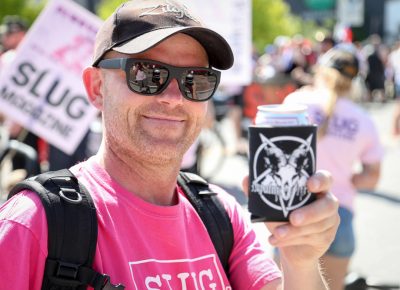 Jason Cowley is one koozie away from a Pride Parade party foul. Photo: John Barkiple