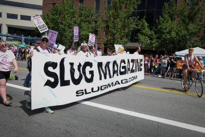 SLUG Magazine has proudly marched in the last dozen Pride parades, and SLUG has won many awards from the Pride Parade officials. Count on SLUG to offer up clever parade attire and sassy innuendo. Photo: John Barkiple