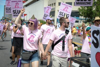 (L–R) Heather Mahler and Eric Taylor bring a little romantic activism to the pride parade. Photo: John Barkiple