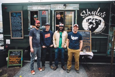 (L–R) Shylo’s Dwaine Blackwell, Jon Nunez, Trent Campbell, top, and Fisher co-owners Tommy Fisher Riemondy, Tim Dwyer, Colby Frazier and Steven Brown, bottom, combine brewery and food truck forces. Photo: johnnybetts.com.