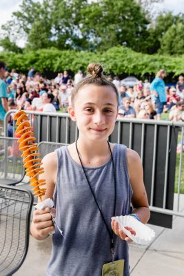 Emily scored a Spud on a Stick, one of the food vendors at this year's Ogden Twilight. Photo: Lmsorenson.net